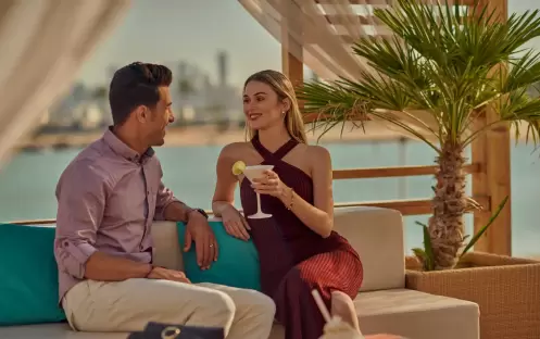 middle-east-holidays-qatar-grand-hyatt-doha-monkey-tale-doha-couple-enjoying-drink